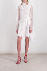 Fluid asymmetric dress with sheer trumpet sleeves